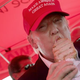 Republican presidential candidate Donald Trump eats a pork chop on a stick and gives a thumbs-up sign to fairgoers at the Iowa State Fair Aug. 15, 2015, in Des Moines.
Win McNamee/Getty Images
